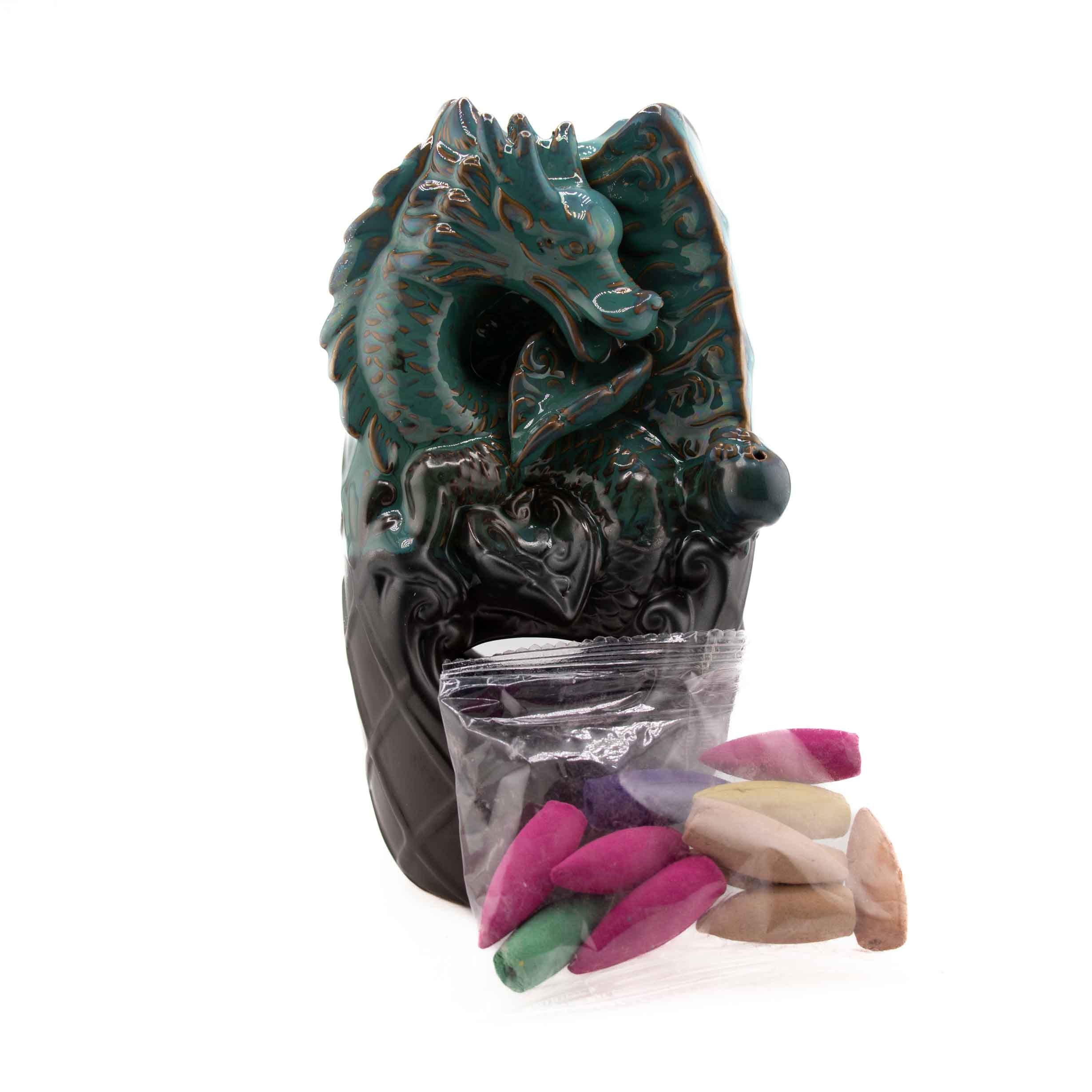 A dual ceramic backflow incense burner featuring a teal dragon perched atop a dark base, accompanied by a bag of colorful incense cones.