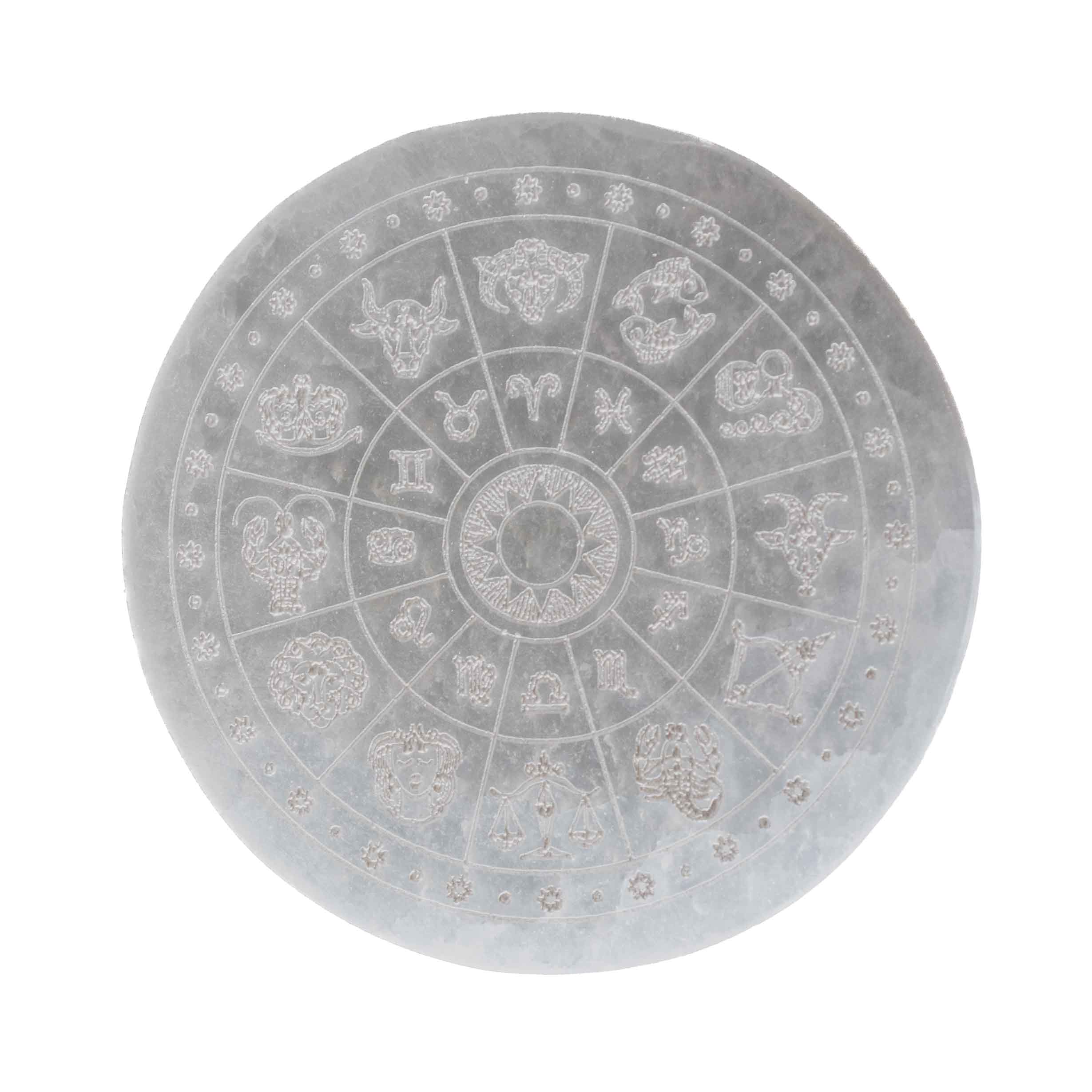 4-inch round white selenite crystal charging plate engraved with all 12 zodiac signs and sun wheel map design on white background.